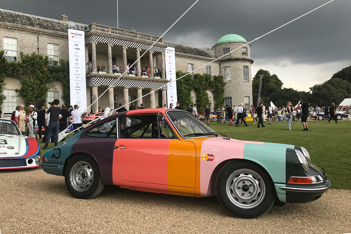 Richard drives the Paul Smith 911 up the hill at Goodwood